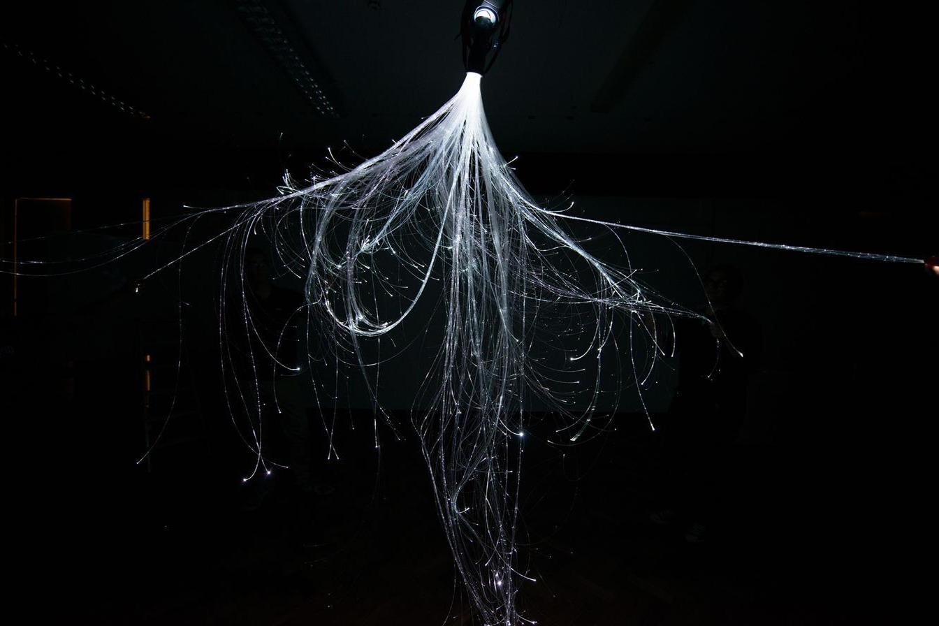 Close detail of the fibre-optic strands, lit white